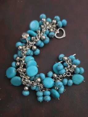 925 bracelet with Blue stones and 925 Italy Heart charms. sz7. 75.29gs